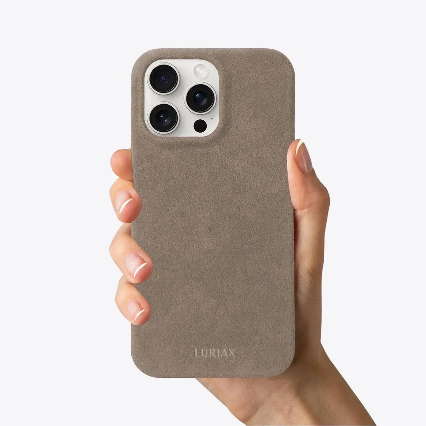 The Sport Alcantara Suede iPhone 16 Pro Max Case in Malibu Beige on White Titanium by Luriax - Front View Held in Hand