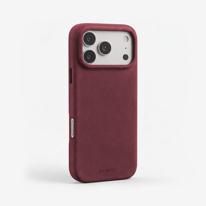 The Signature Handcrafted Case — iPhone 17 in Bordeaux, Alcantara® — three-quarter view | Luriax