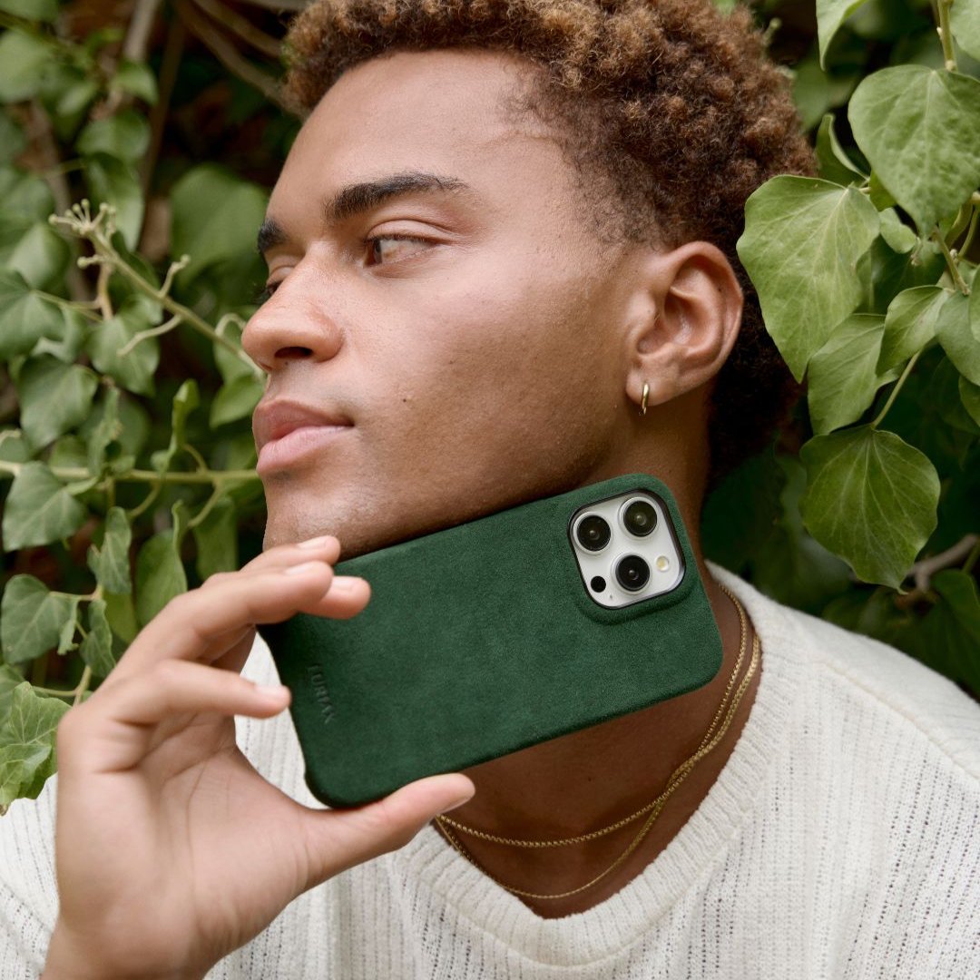 The Classic Alcantara Suede iPhone 16 Pro Max Case British Racing Green on White Titanium by Luriax - Lifestyle.jpg