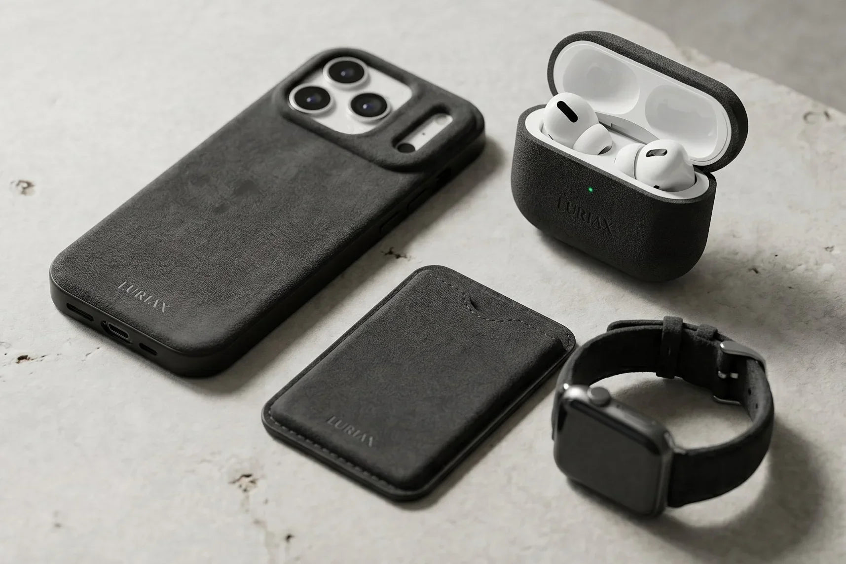 Luriax Black Caviar Alcantara iPhone case, AirPods case, cardholder & watch band with suede texture on concrete