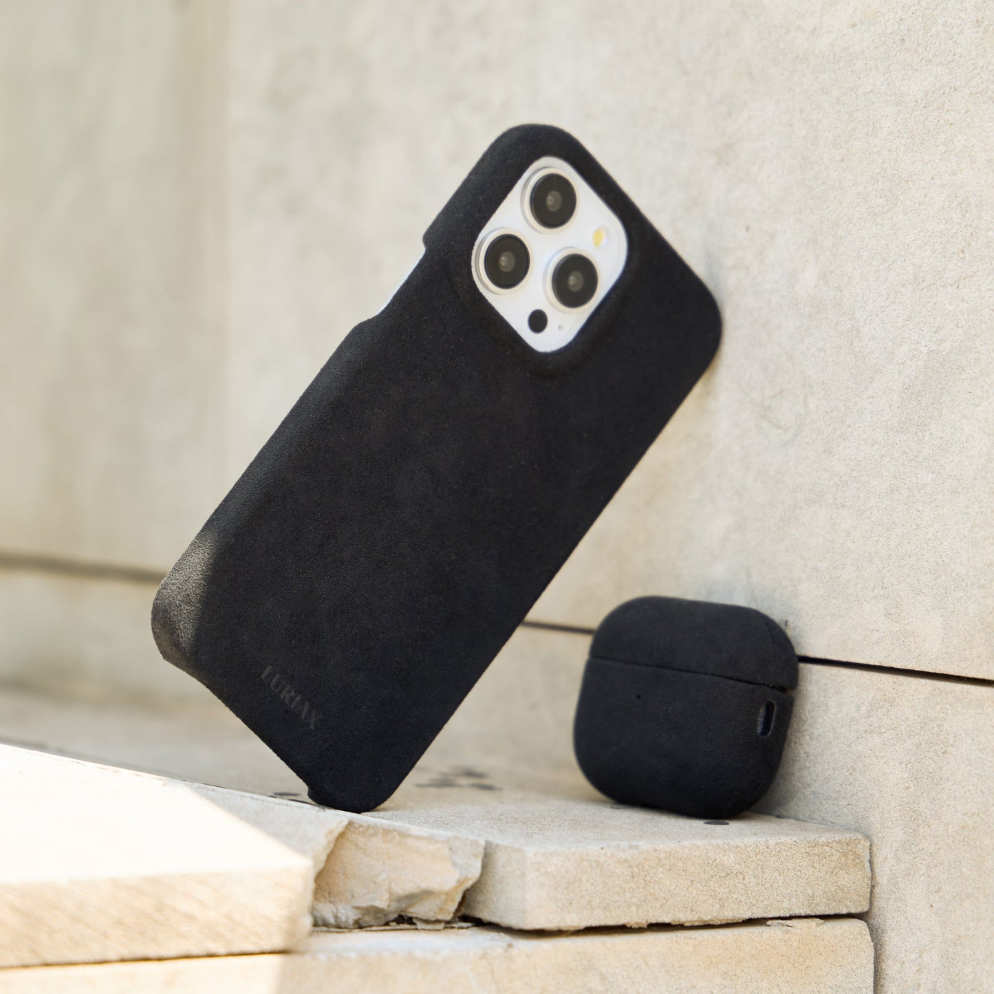 The Sport Alcantara Suede iPhone 16 Pro Max Case in Pure Black on White Titanium by Luriax - Lifestyle