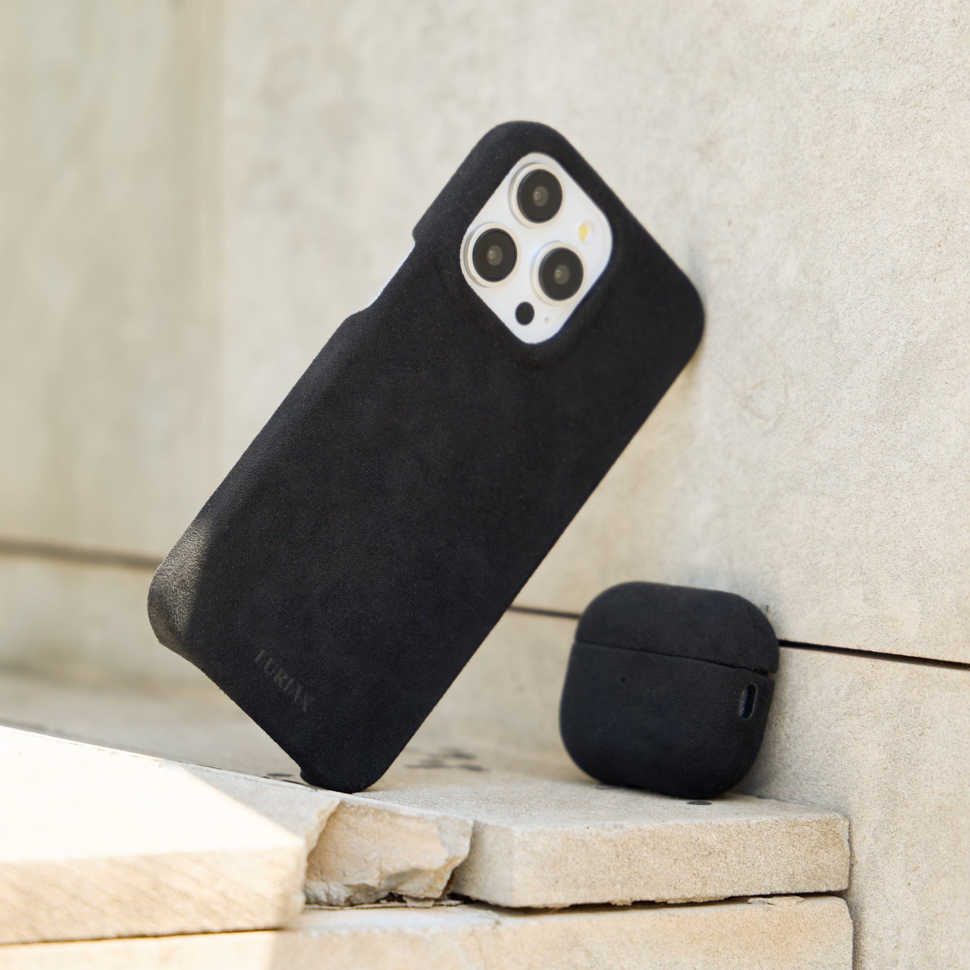 The Sport Alcantara Suede iPhone 16 Pro Max Case in Pure Black on White Titanium by Luriax - Lifestyle