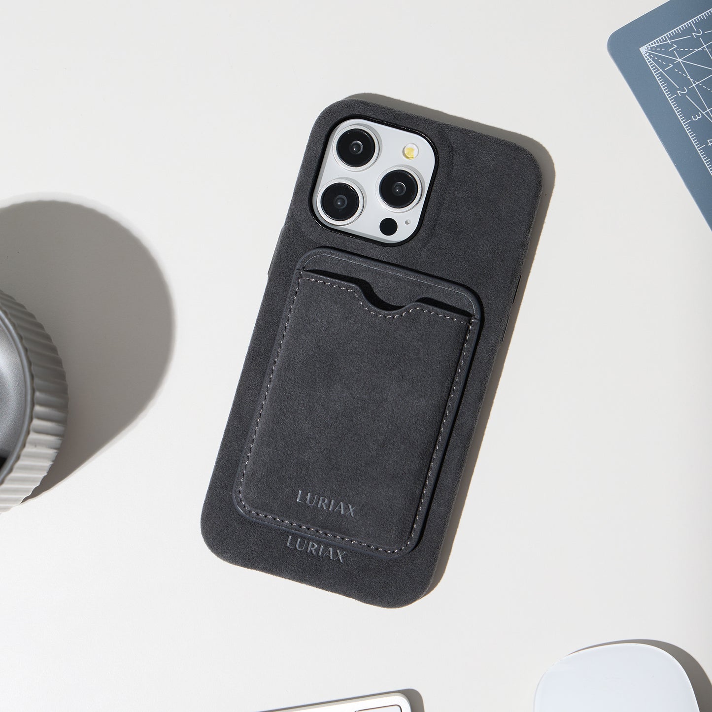 The Classic Alcantara Suede iPhone 16 Pro Max Case Charcoal Black on White Titanium by Luriax - Lifestyle.jpg