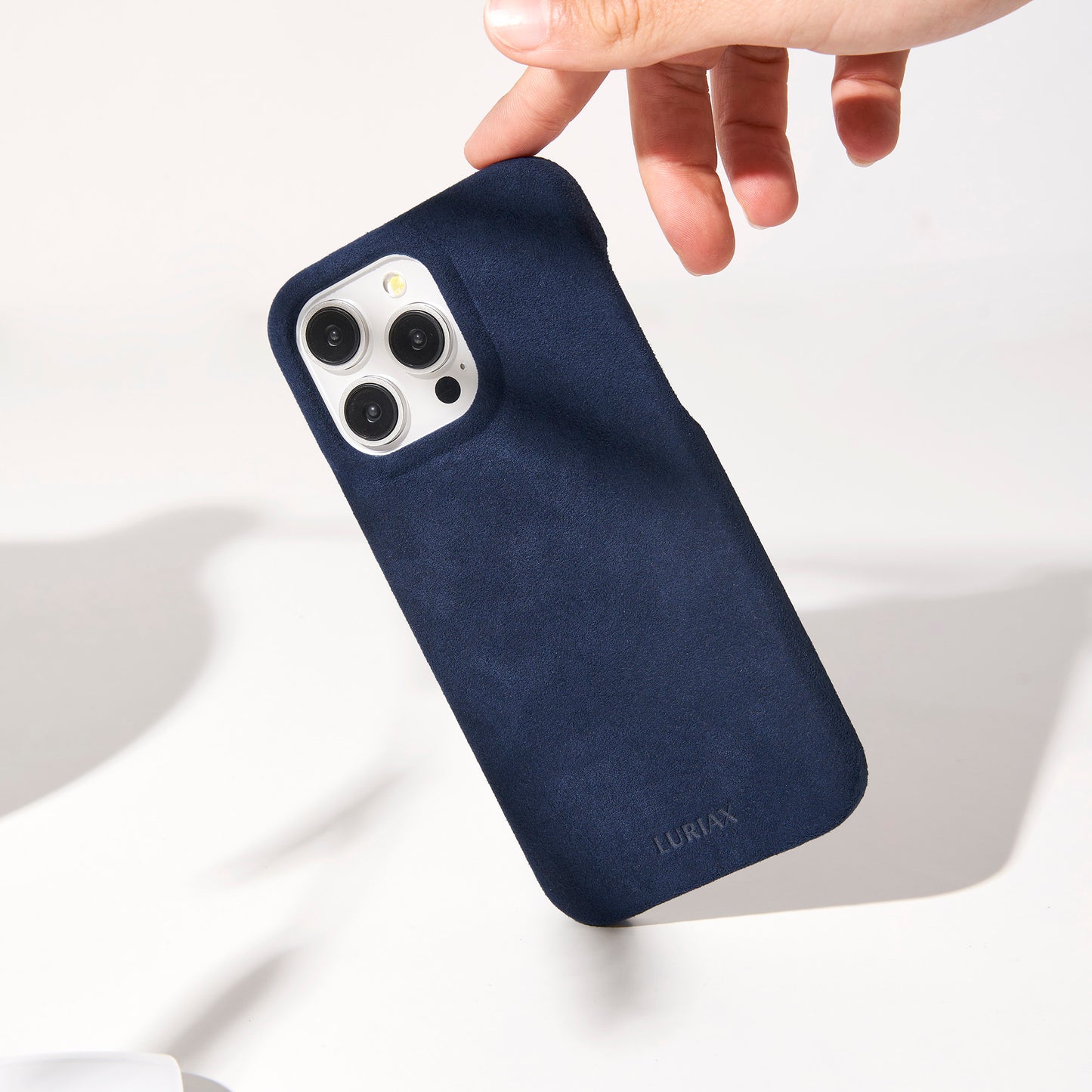 The Sport Alcantara iPhone 16 Pro Max Case in Dark Blue on White Titanium by Luriax - Lifestyle