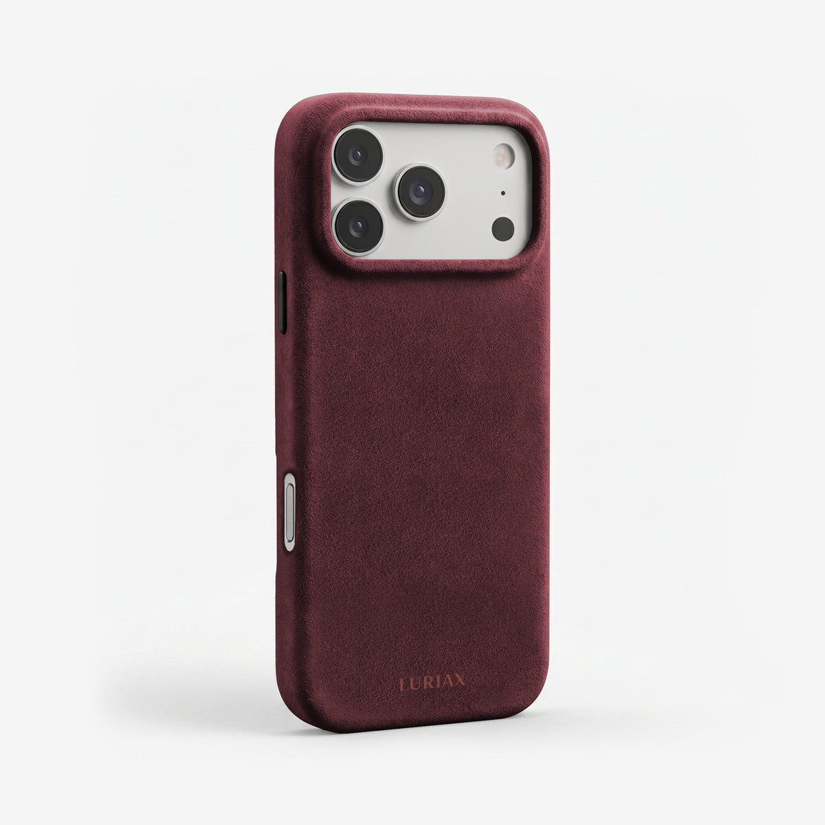 The Signature Handcrafted Case — iPhone 17 in Bordeaux, Alcantara® — three-quarter view | Luriax